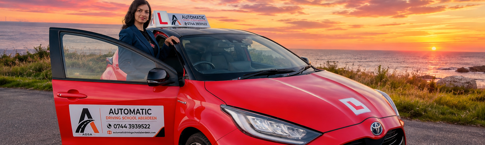 Tehmina beside her Automatic Driving School Aberdeen tuition car