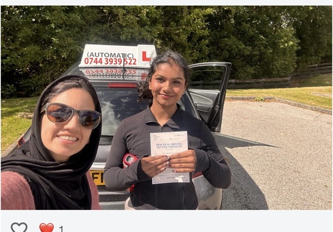 Kathy George celebrating a driving test pass with Tehmina at Automatic Driving School Aberdeen