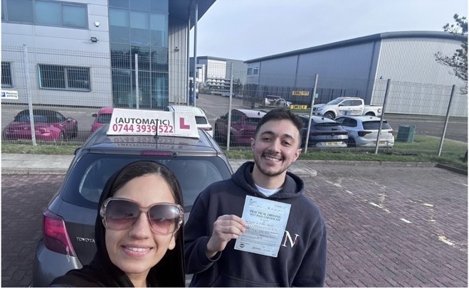 Yousef celebrating a driving test pass with Tehmina at Automatic Driving School Aberdeen